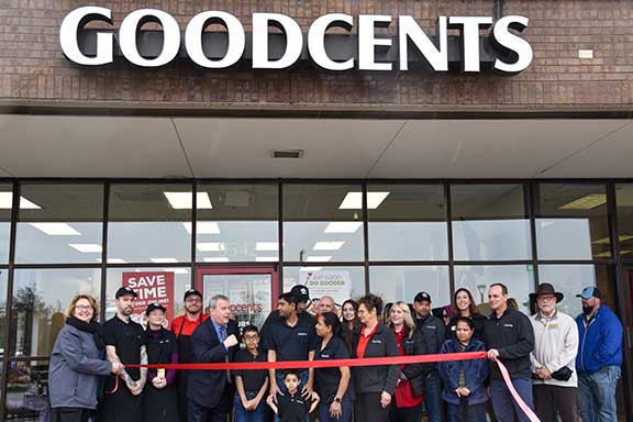 people standing in front of new goodcents