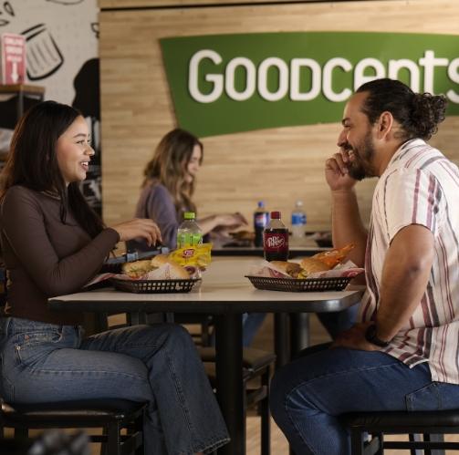 Two people eating at a Goodcents