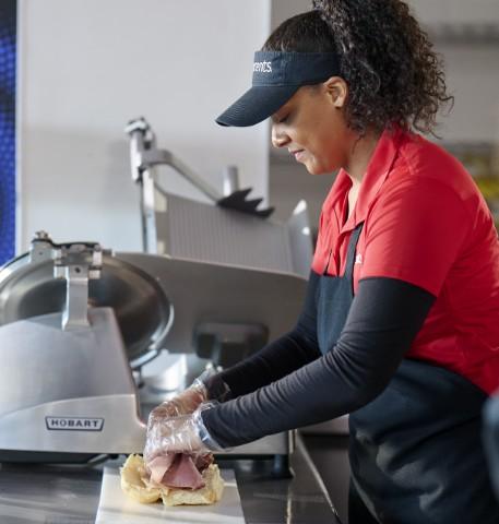 Goodcents employee making a sub