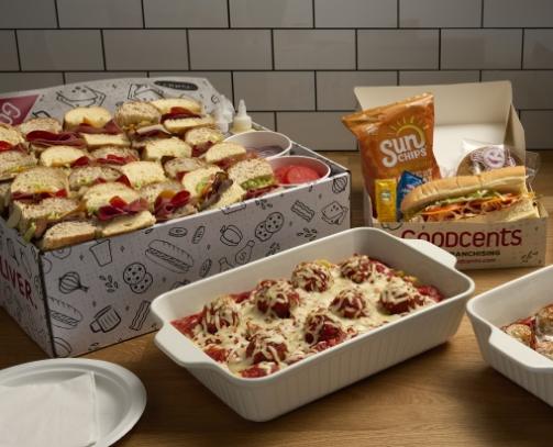 Catered food options including small sandwiches and meatballs